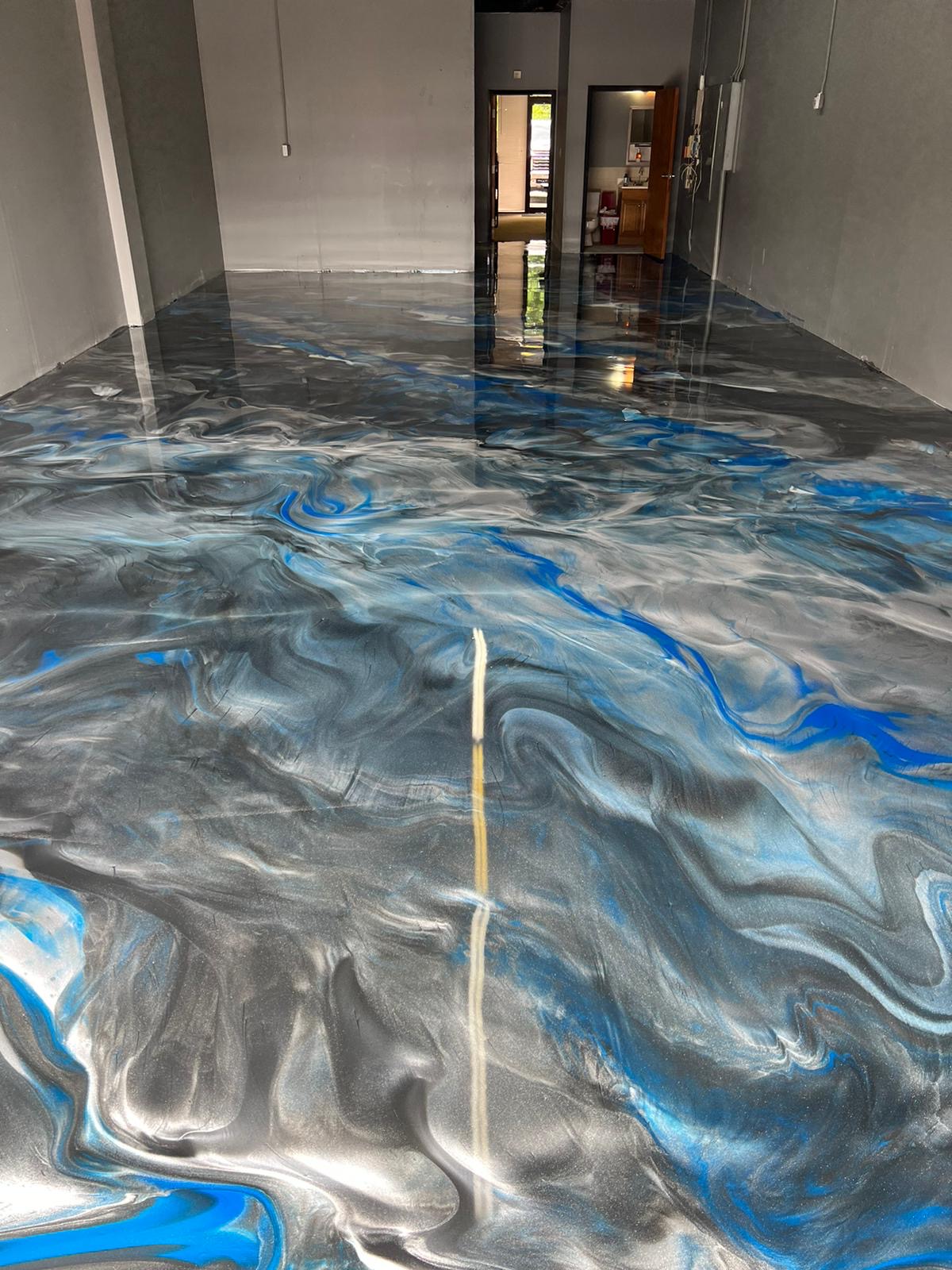 Blue and silver metallic epoxy floor
